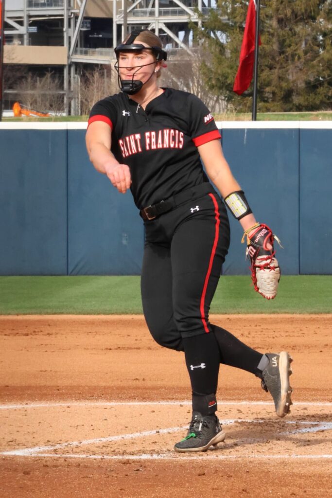 Maddy Bates pitching for her college softball team — HammerZone Softball instructor