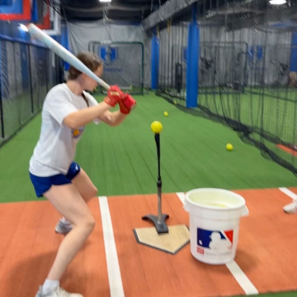 Middle school softball player hitting during training at HammerZone Sports